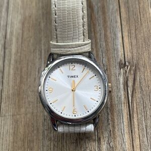 Timex women’s Silver Case and Face,Gold tone Dial Watch with Pearl Leather Strap